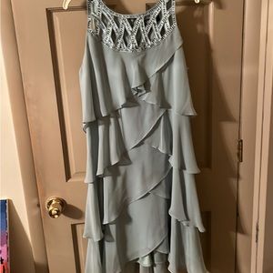 Beautiful embellished lattice front dress with asymmetrical ruffles